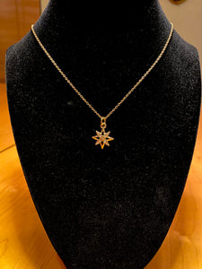 18" long gold plated chain with gold star pendant