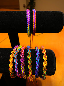 Hand made bracelets. Nylon material, adjustable sizes. Available in two styles, flat and twisted. 